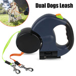 Black dual retractable dog leash with two clips and built-in flashlight