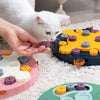 Cat using interactive food puzzle feeder
